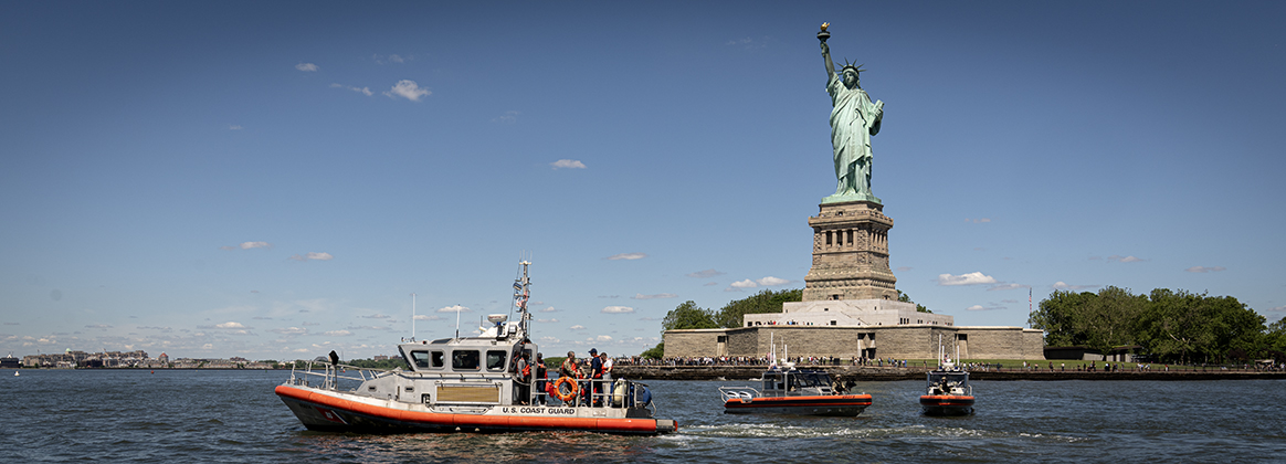 Coast Guard boat in front of Statue of Liberty